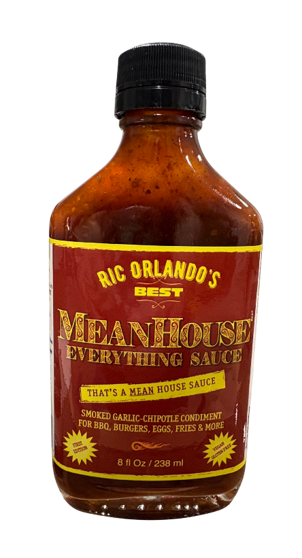 Hot sauce bottle with red label.