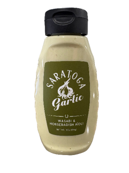 Wasabi horseradish aioli bottle, black background.